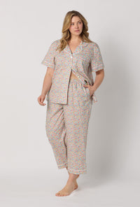 A lady wearing plus size Emma & Georgina Short Sleeve Classic Woven Tana Lawn® Cropped Pj Set Made With Liberty Fabric front view
