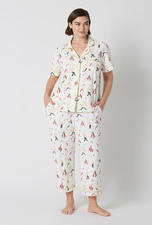 A Lady Wearing Plus Size Bar A Vin Short Sleeve Classic Stretch Jersey Cropped Pj Set in a front facing pose