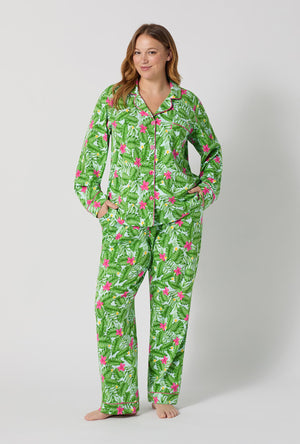 A Lady Wearing Plus Size Monstera Bloom Long Sleeve Classic Stretch Jersey Pj Set posing with a front view