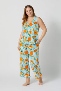A lady wearing plus size Golden Breeze Ruffle Tank Stretch Jersey Cropped Pj Set