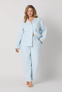 A lady wearing plus size Baby's Breath Blue Long Sleeve Classic Woven Linen Pj Set front view