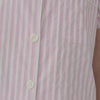 A lady wearing a pink and white stripes short sleeve shorty pj set.