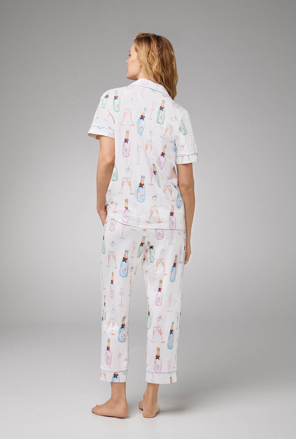 A lady wearing Short Sleeve Classic Stretch Jersey Cropped PJ Set with Champagne Wedding print