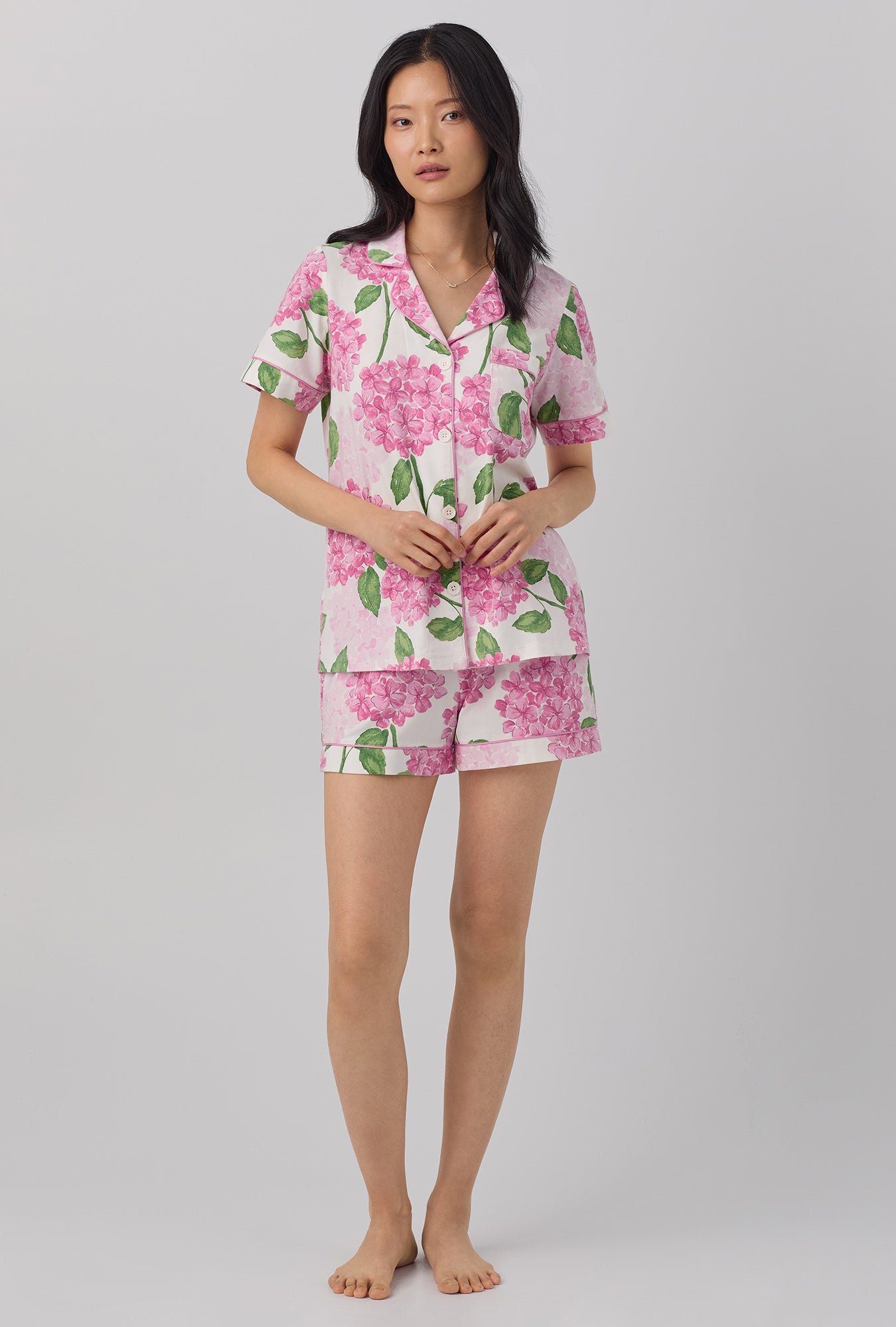 A lady wearing pink  Short Sleeve Classic Shorty Stretch Jersey PJ Set with Grand Hydrangea print.