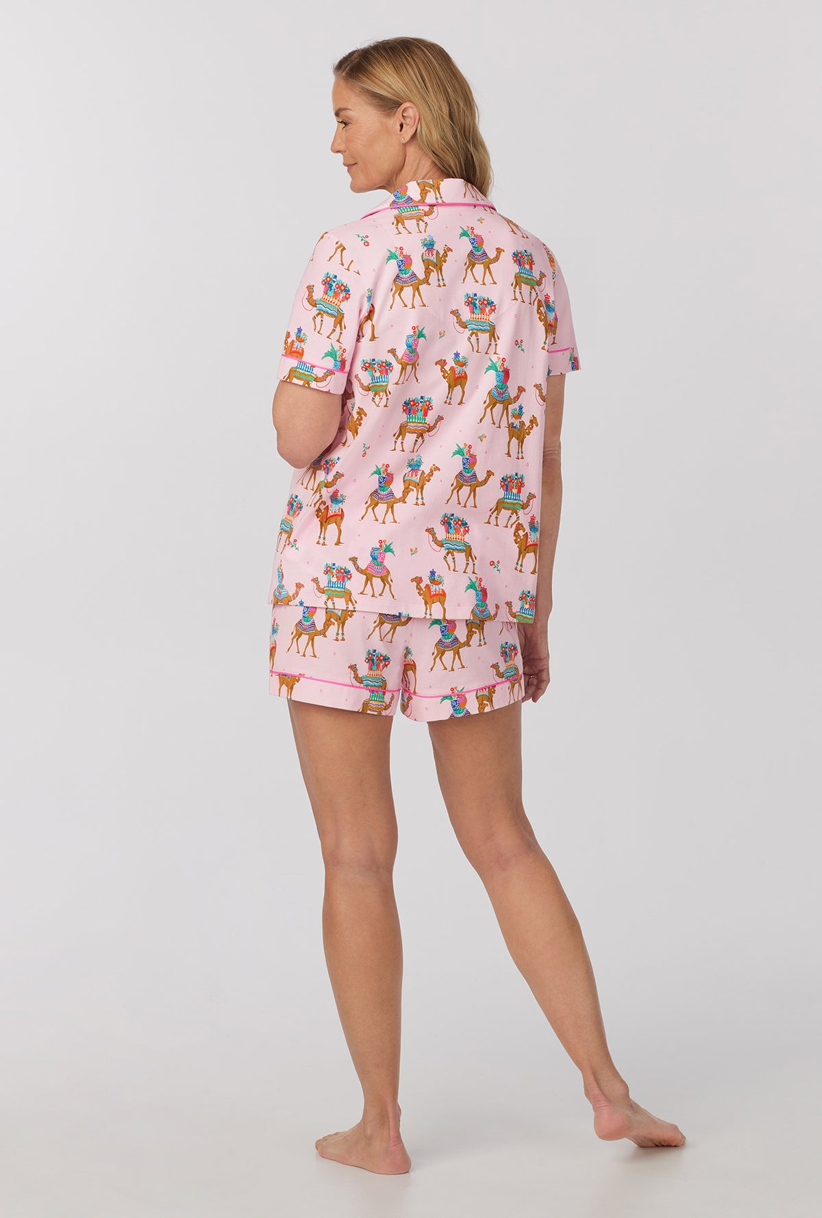 A lady wearing pink Short Sleeve Classic Shorty Stretch Jersey PJ Set with fancy camels print