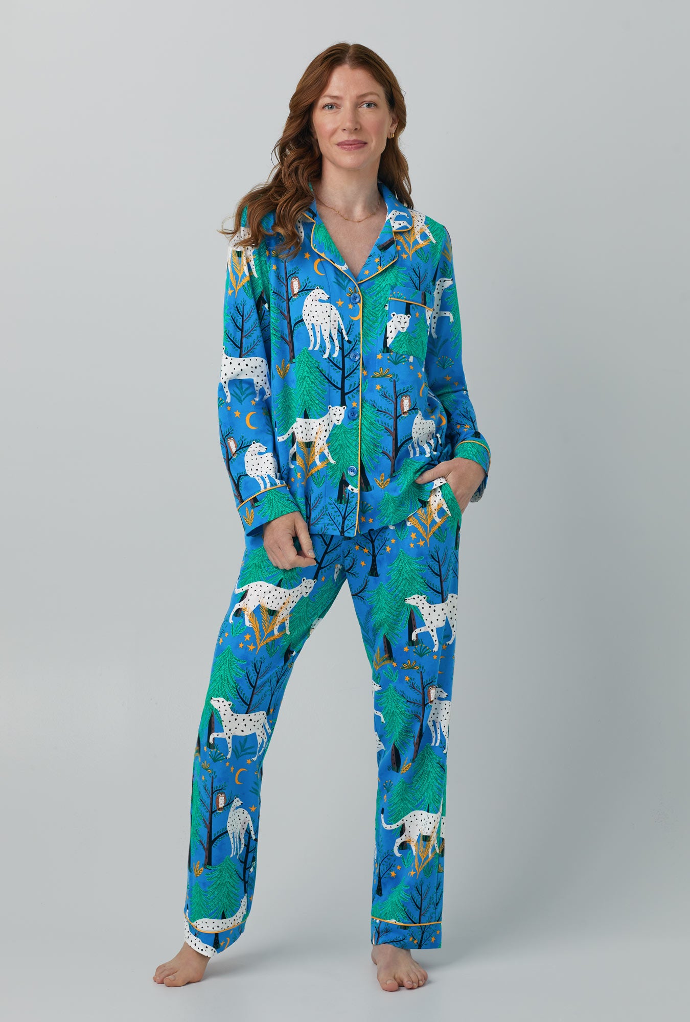 A lady wearing blue Long Sleeve Classic Stretch Jersey PJ Set with Enchanted Forest print