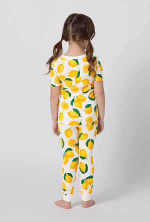 A girl wearing White and  Yellow Short Sleeve Stretch Jersey Kids Pj Set back view