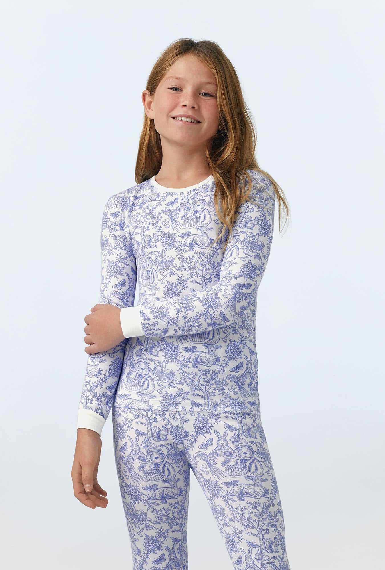 A girl wearing Fairytale Forest Long Sleeve Stretch Jersey Kids PJ Set