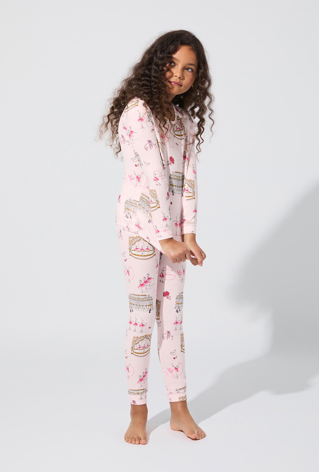 A girl wearing Swan Lake Long Sleeve Stretch Jersey Kids PJ Set
