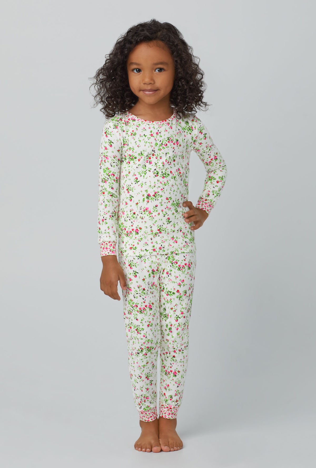 A girl wearing Long Sleeve Stretch Jersey Kids PJ Set with nellie print