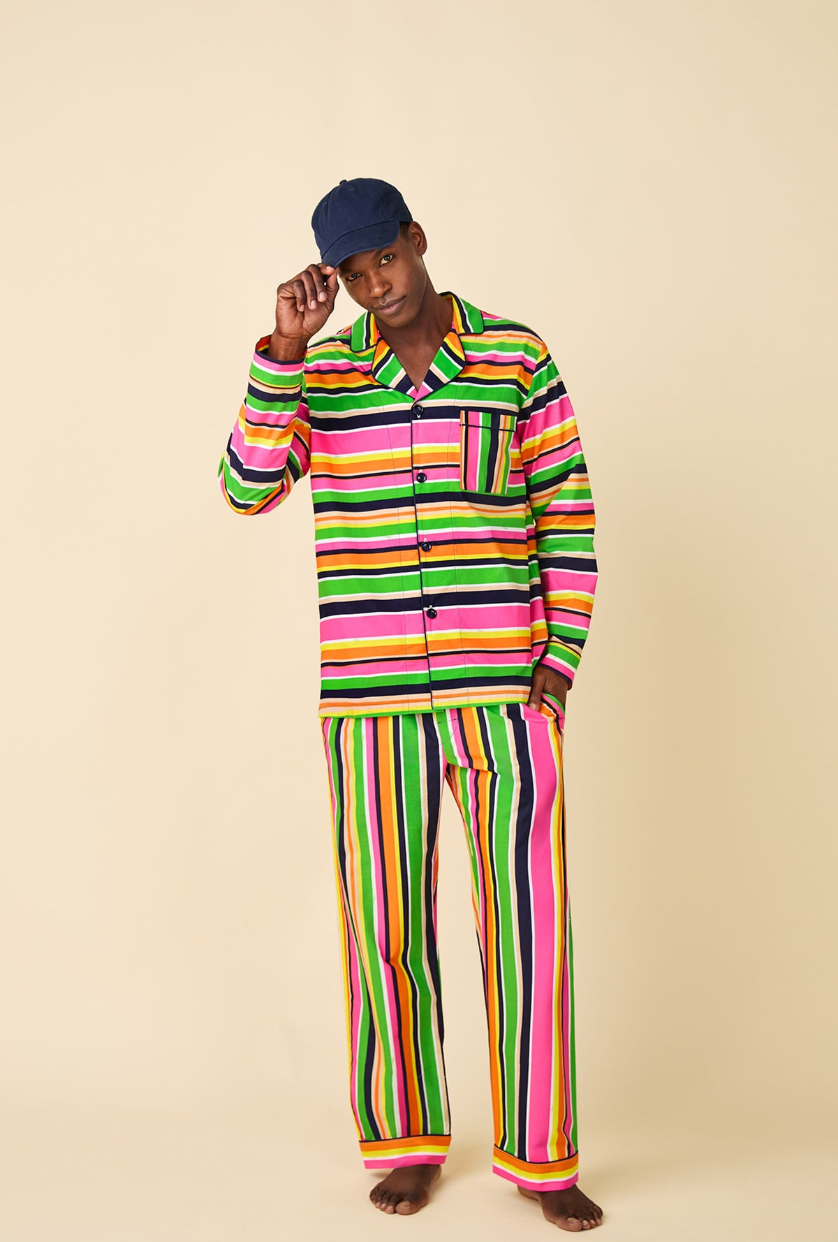 A man wearing BedHead x Mr. Turk Poolside Stripe Men&#39;s Long Sleeve Classic Woven Cotton Poplin PJ Set