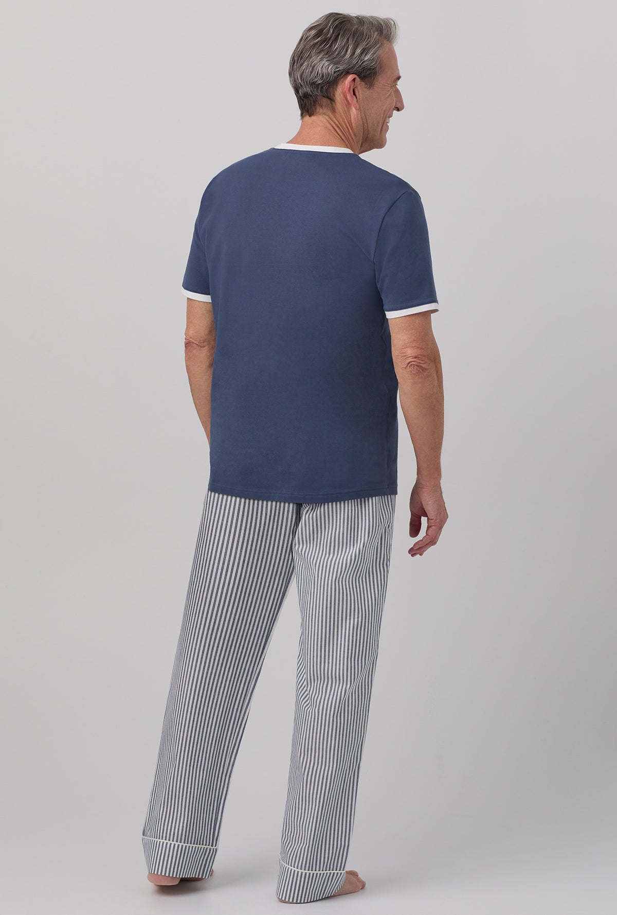 A man wearing blue short sleeve tee pj set with blue south shore stripe print.