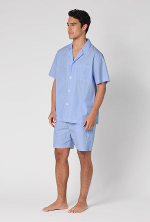 A Man Wearing French Stripe Men's Short Sleeve Woven Supersoft Cotton Poplin Short Pj Set in a side angled pose