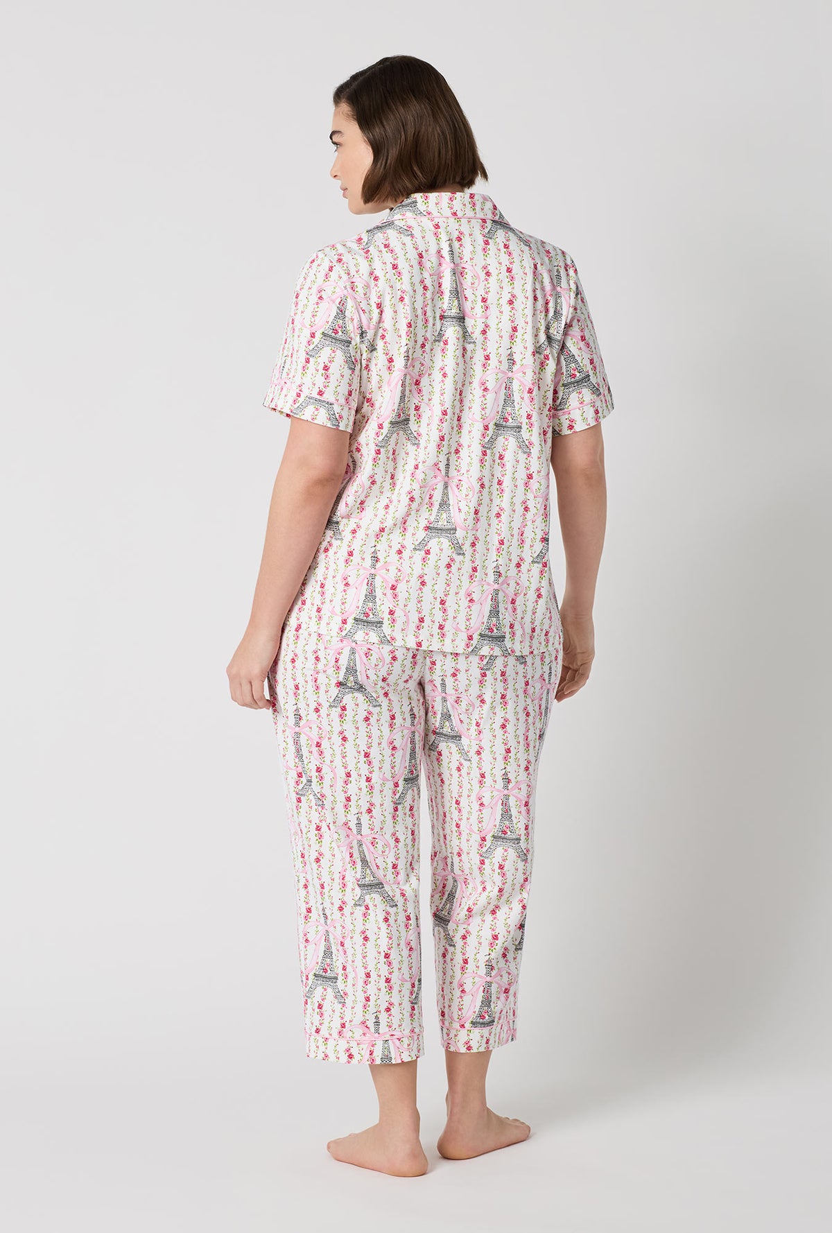 A Lady Wearing Plus Size Fleur De La Tour Short Sleeve Classic Stretch Jersey Cropped Pj Set in a back view pose