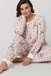 A Lady Wearing Plus Size Fleur De La Tour Long Sleeve Pullover Crew And Jogger Stretch Jersey Pj Set in a sitting close up shot