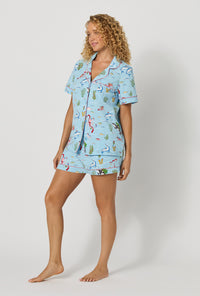 A lady wearing Jingle All The Wave Short Sleeve Classic Shorty Stretch Jersey Pj Set looking side