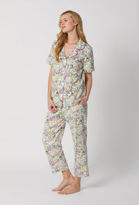 A Lady Wearing Multi Color Short Sleeve Classic Stretch Jersey Cropped PJ Set with Cottage Garden Print Side Angle View
