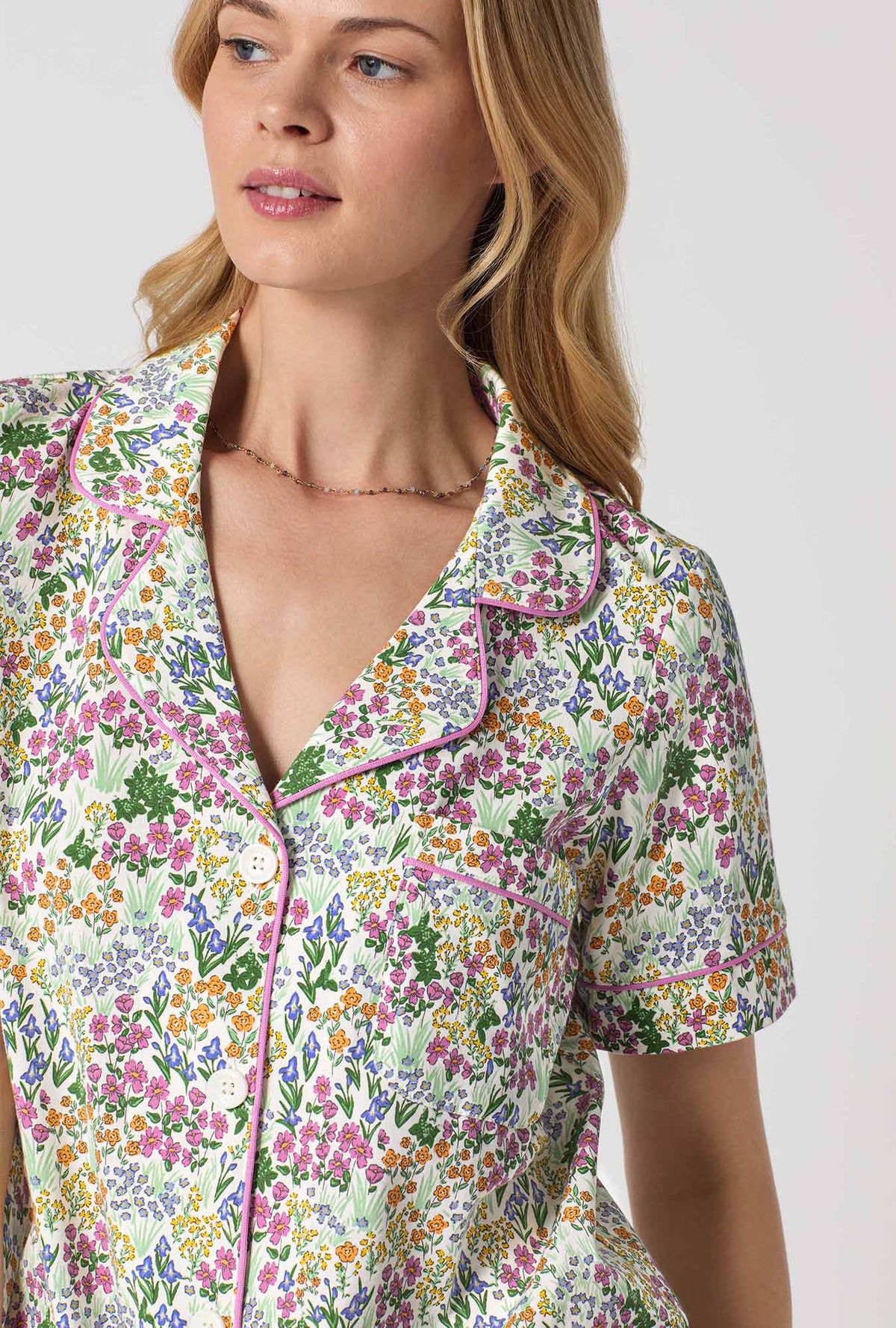 A Lady Wearing Multi Color Short Sleeve Classic Stretch Jersey Cropped PJ Set with Cottage Garden Print Closeup View