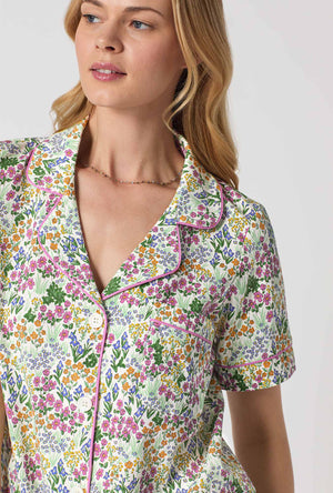 A Lady Wearing Multi Color Short Sleeve Classic Stretch Jersey Cropped PJ Set with Cottage Garden Print Closeup View