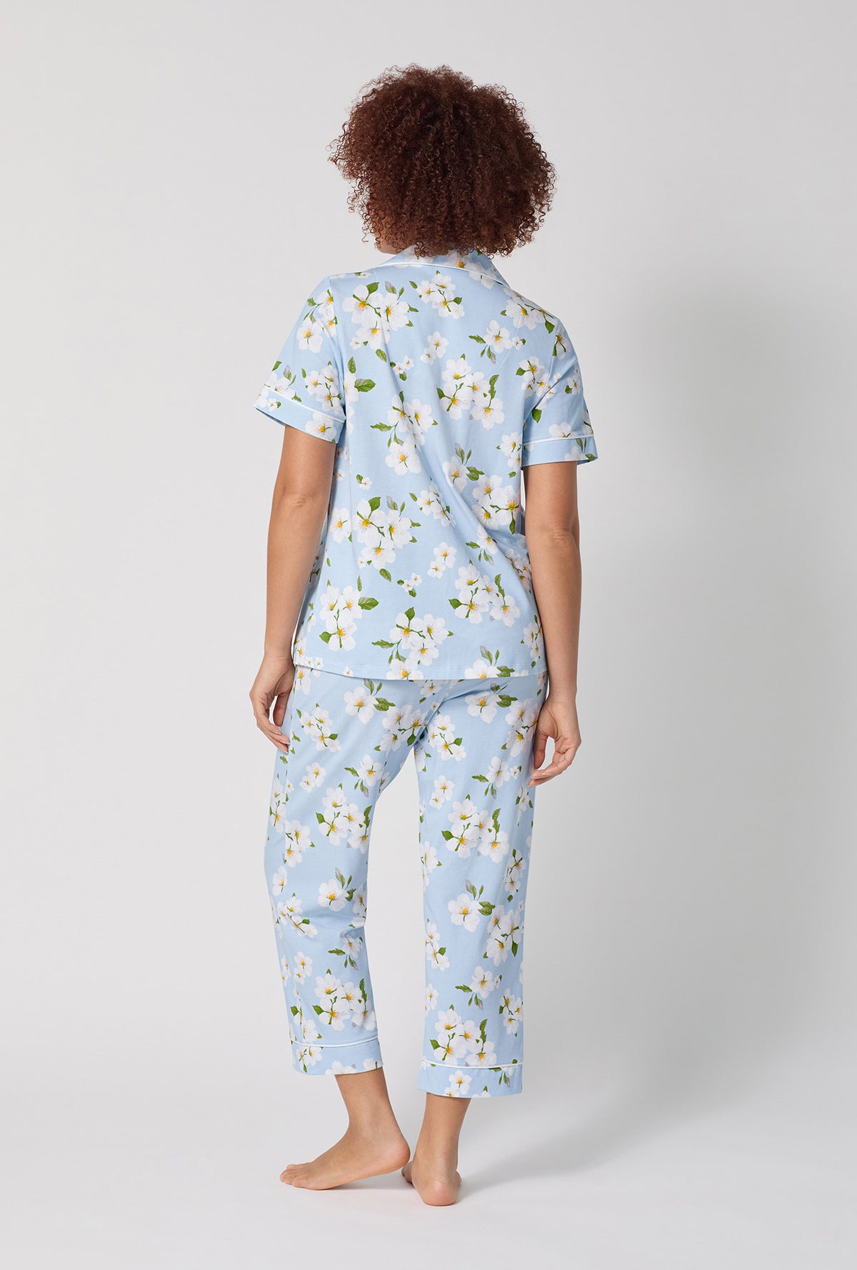 A lady wearing Magnolia Breeze Short Sleeve Classic Stretch Jersey Cropped Pj Set