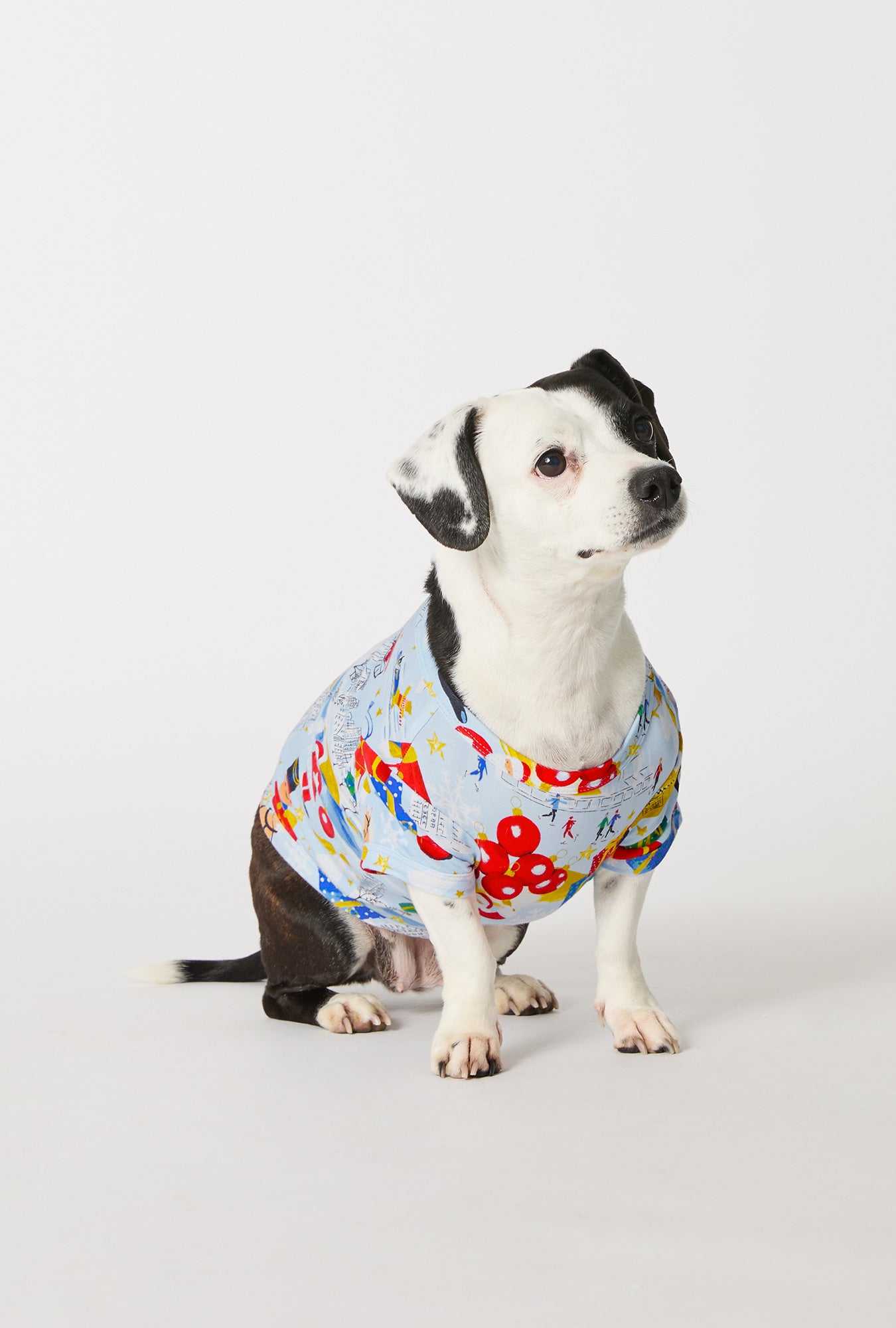 A dog wearing A City Christmas Stretch Jersey Dog Pajama