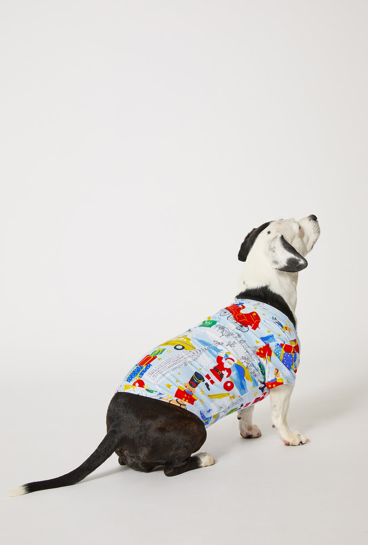 A dog wearing A City Christmas Stretch Jersey Dog Pajama