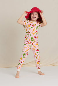 A closeup of A girl wearing Pink Short Sleeve Stretch Jersey Kids Pj Set