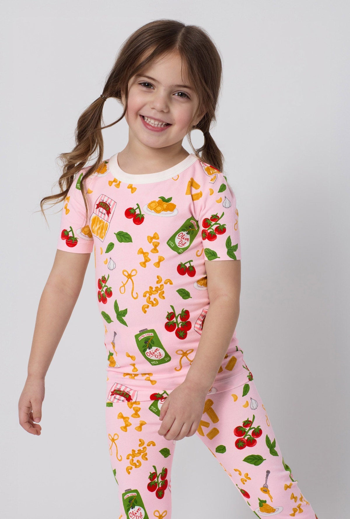 A closeup of A girl wearing Pink Short Sleeve Stretch Jersey Kids Pj Set