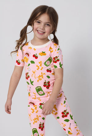 A closeup of A girl wearing Pink Short Sleeve Stretch Jersey Kids Pj Set