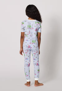 A Girl Wearing Belle Vie Short Sleeve Stretch Jersey Kids Pj Set in a back view pose