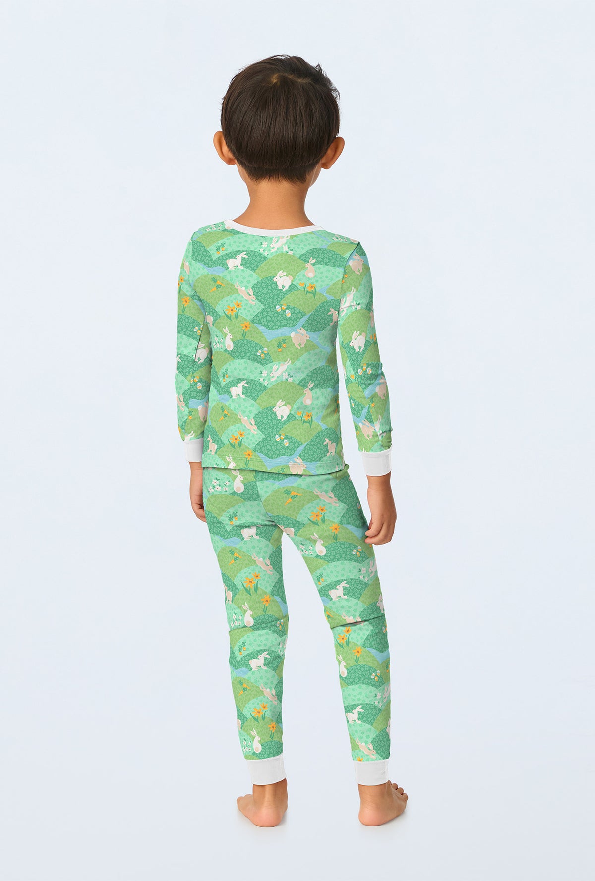 A boy wearing Hop To It Long Sleeve Stretch Jersey Kids PJ Set