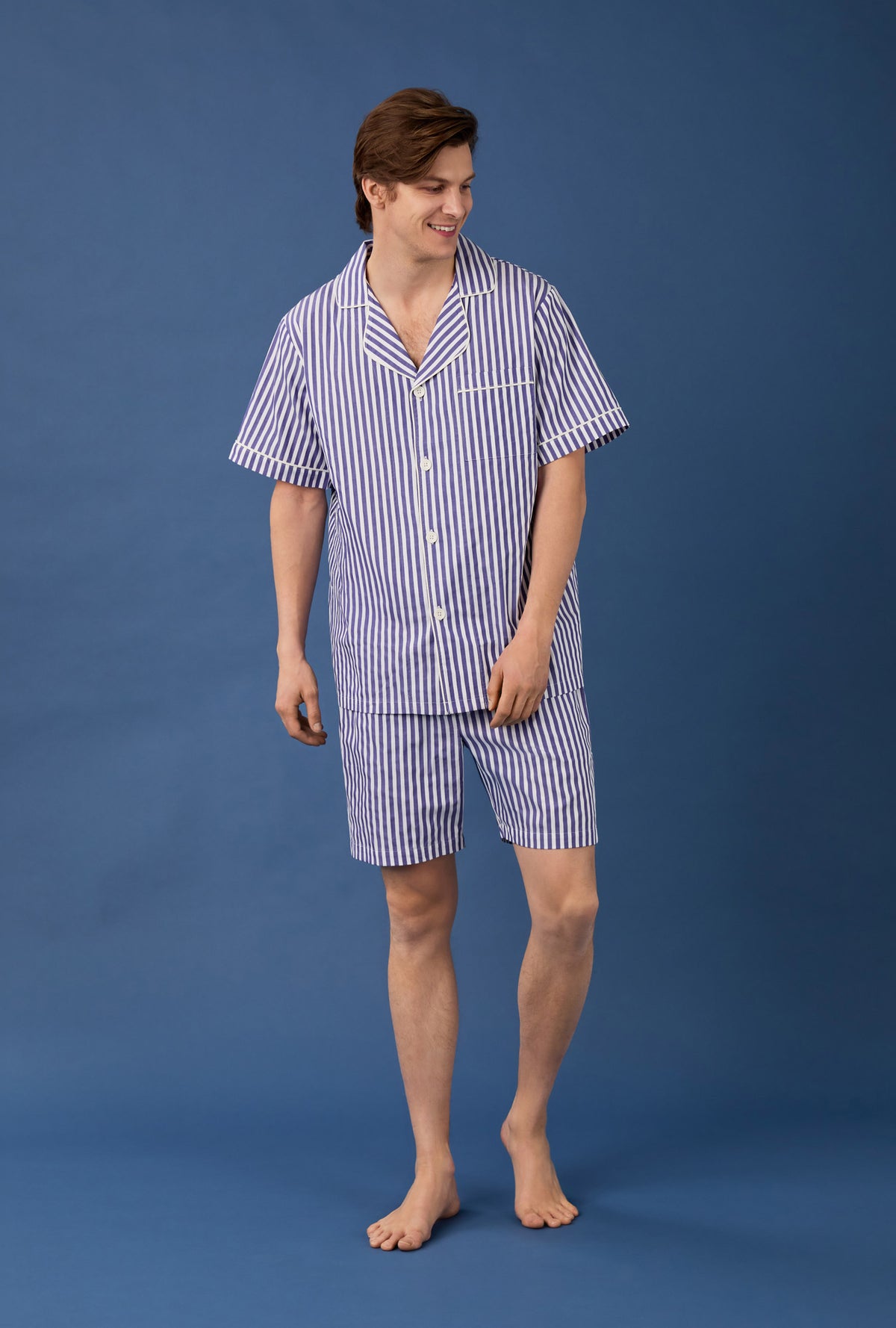 A man wearing Navy 3D Stripe Men&#39;s Short Sleeve Notch Woven Cotton Sateen Boxer PJ Set