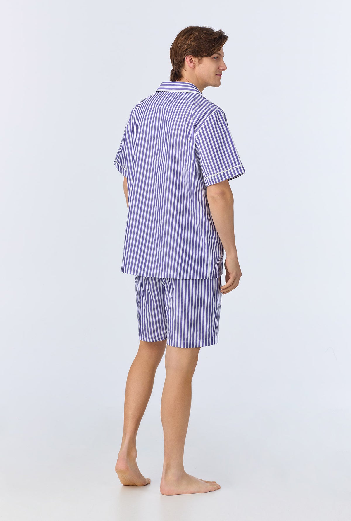 A man wearing Navy 3D Stripe Men&#39;s Short Sleeve Notch Woven Cotton Sateen Boxer PJ Set