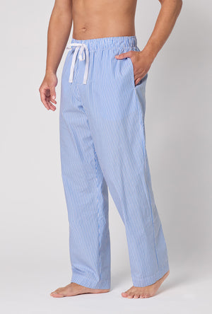 A Man Wearing French Stripe Men's Woven Supersoft Cotton Poplin Pj Pant in a side angled pose with one hand placed inside a pocket