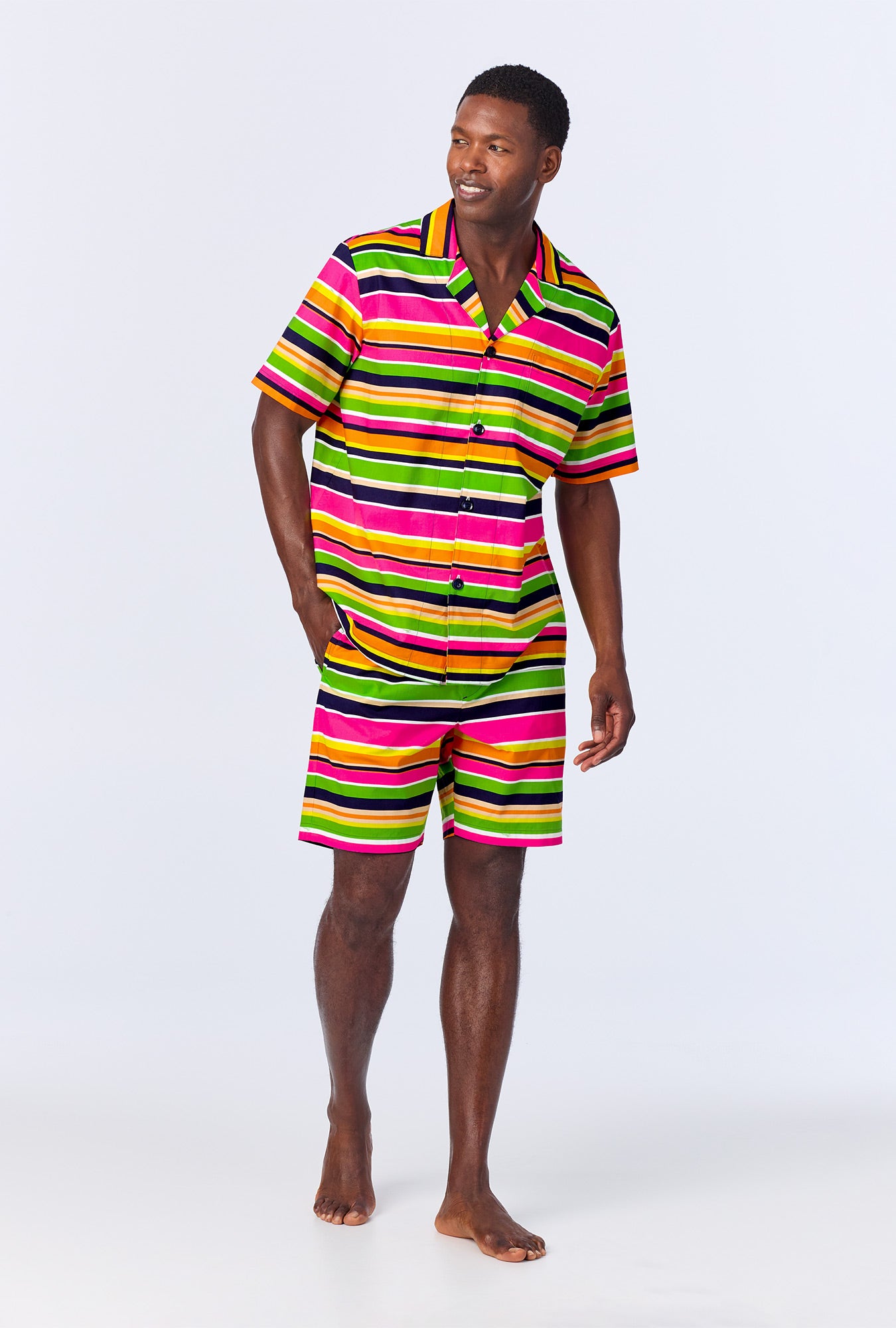 A man wearing BedHead x Mr. Turk Poolside Stripe Men's Sleeve Notch Woven Cotton Poplin Boxer PJ Set