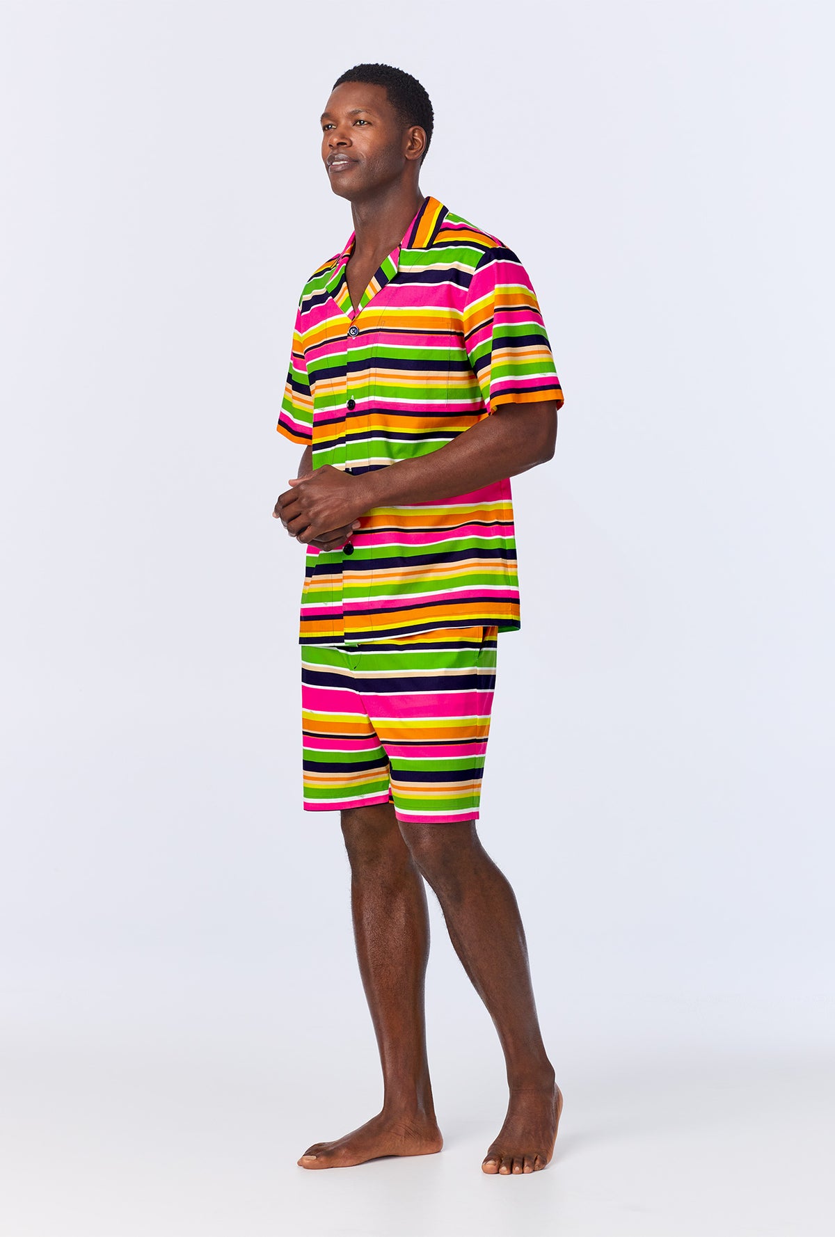 A man wearing BedHead x Mr. Turk Poolside Stripe Men&#39;s Sleeve Notch Woven Cotton Poplin Boxer PJ Set