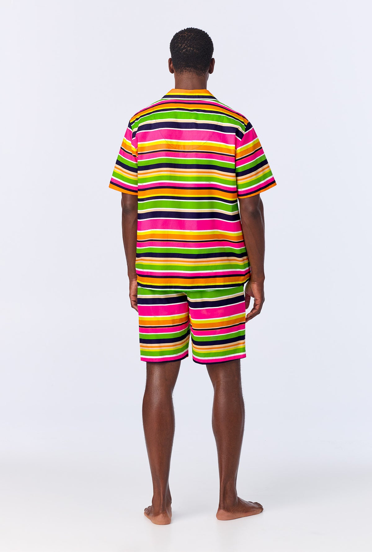 A man wearing BedHead x Mr. Turk Poolside Stripe Men&#39;s Sleeve Notch Woven Cotton Poplin Boxer PJ Set