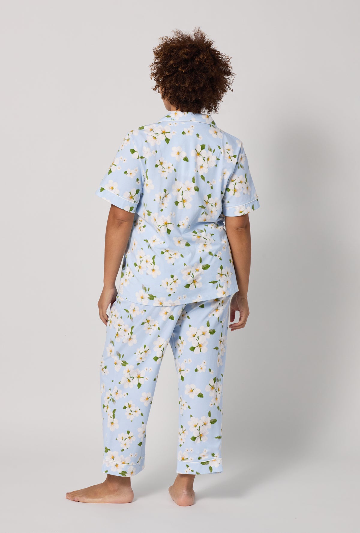 A lady wearing plus Magnolia Breeze Short Sleeve Classic Stretch Jersey Cropped Pj Set