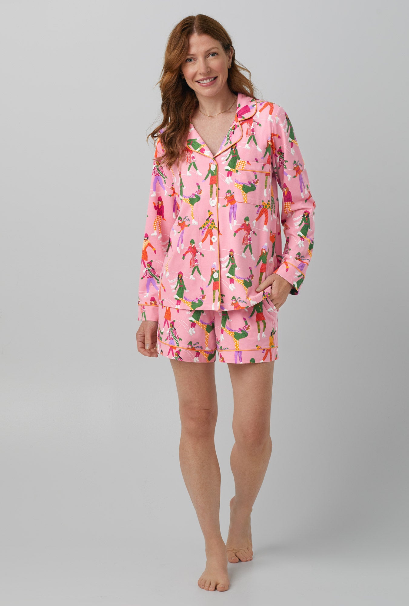 A lady wearing pink Long Sleeve Classic Stretch Jersey Short PJ Set with Skating Away  print