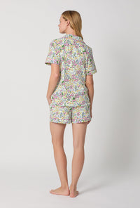 A Lady Wearing Multi Color Short Sleeve Classic Shorty Stretch Jersey PJ Set with Cottage Garden Print Back View
