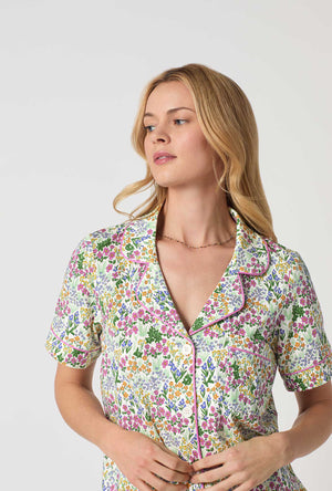 A Lady Wearing Multi Color Short Sleeve Classic Shorty Stretch Jersey PJ Set with Cottage Garden Print Closeup View
