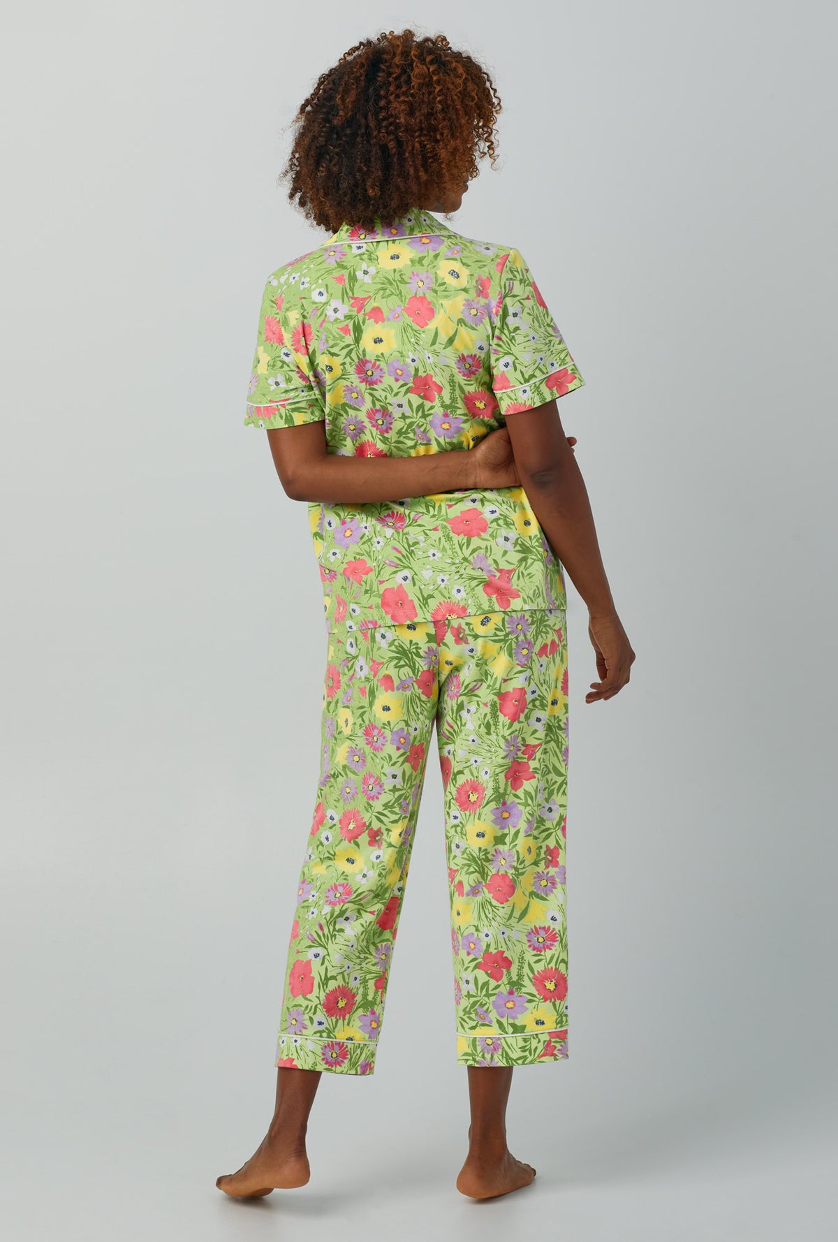 A lady wearing Short Sleeve Classic Stretch Jersey Cropped PJ Set with whispering meadow print
