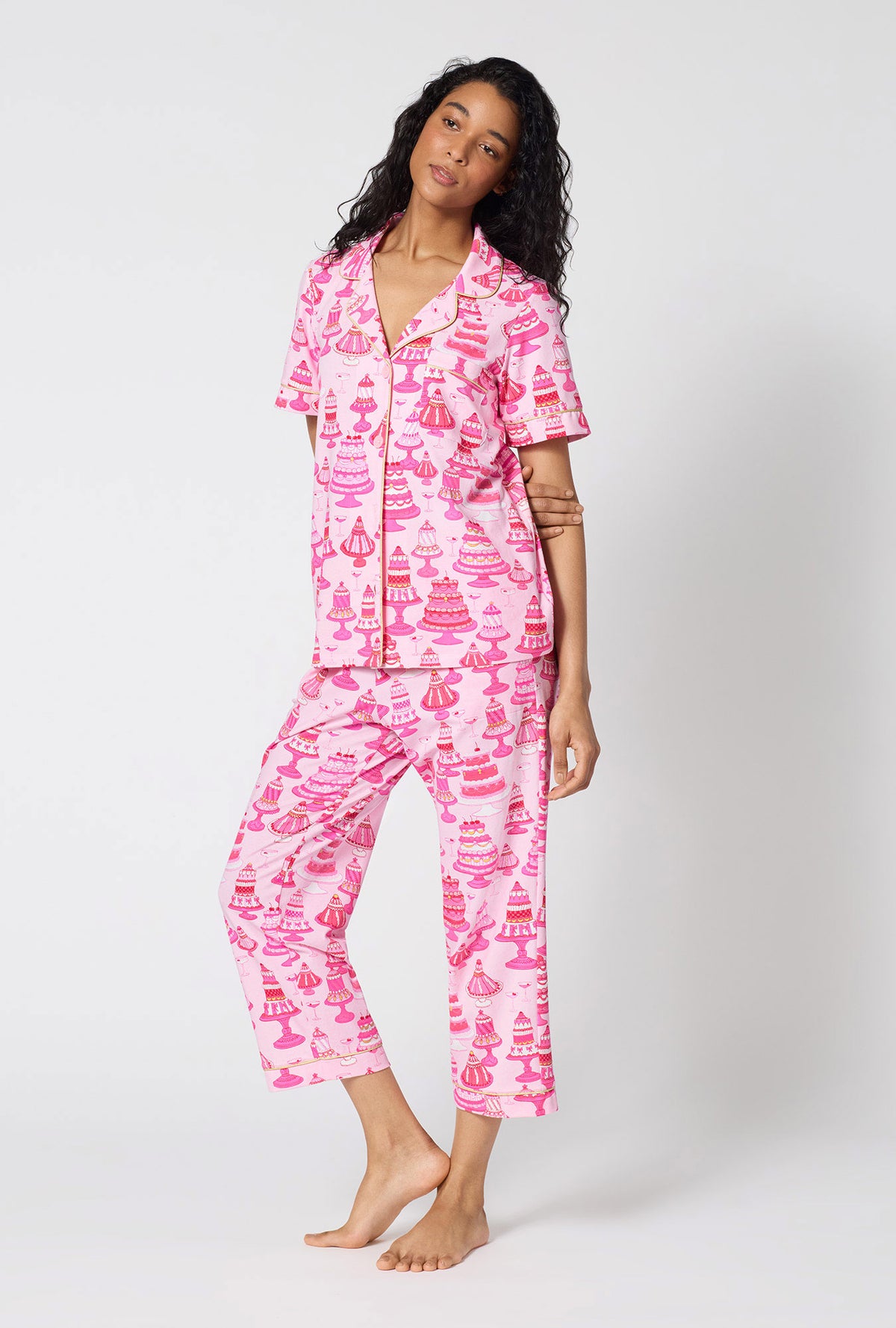 A Lady Wearing Cake Shop Short Sleeve Classic Stretch Jersey Cropped Pj Set facing front in a side angled pose