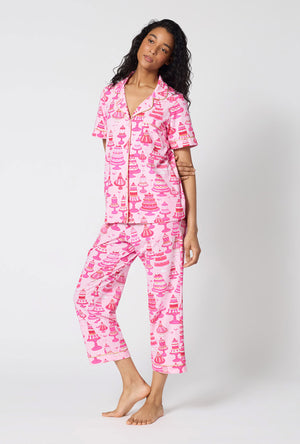 A Lady Wearing Cake Shop Short Sleeve Classic Stretch Jersey Cropped Pj Set facing front in a side angled pose