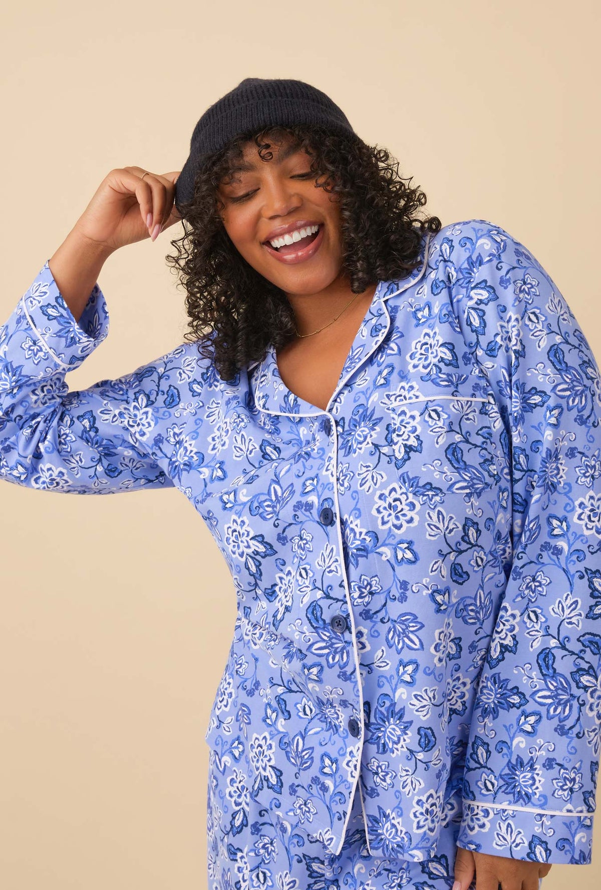 A lady wearing blue long sleeve classic stretch jersey pj set with blue dessert flowers print