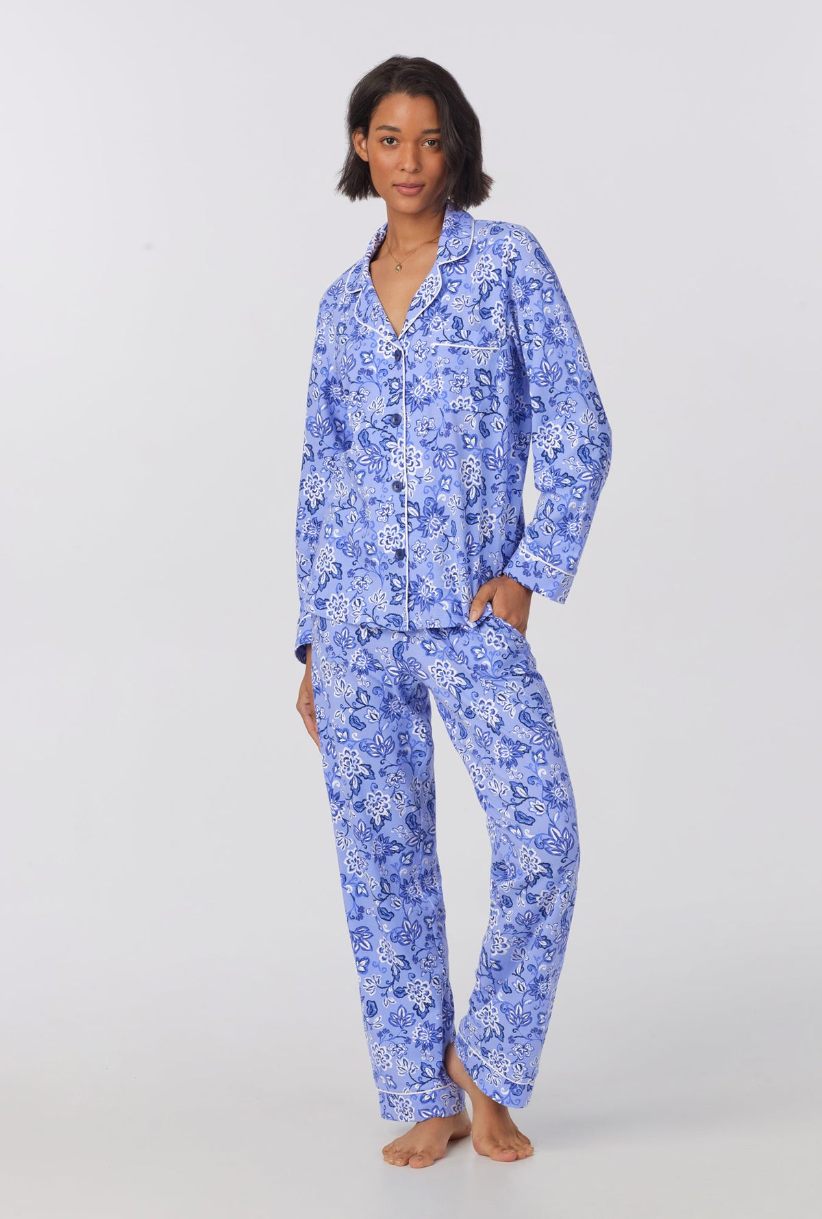 A lady wearing blue long sleeve classic stretch jersey pj set with blue dessert flowers print