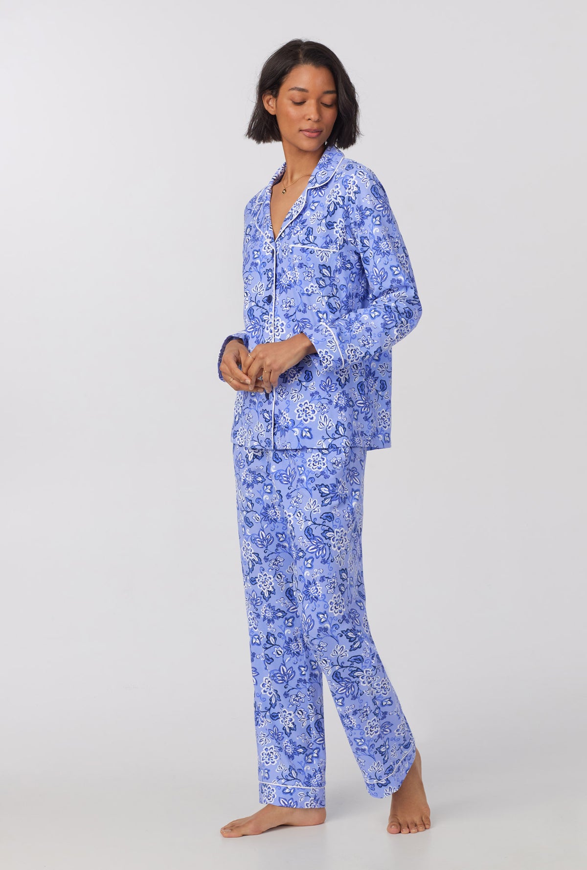 A lady wearing blue long sleeve classic stretch jersey pj set with blue dessert flowers print