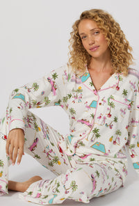 A lady wearing Festive Flamingos Long Sleeve Classic Stretch Jersey Pj Set closer look