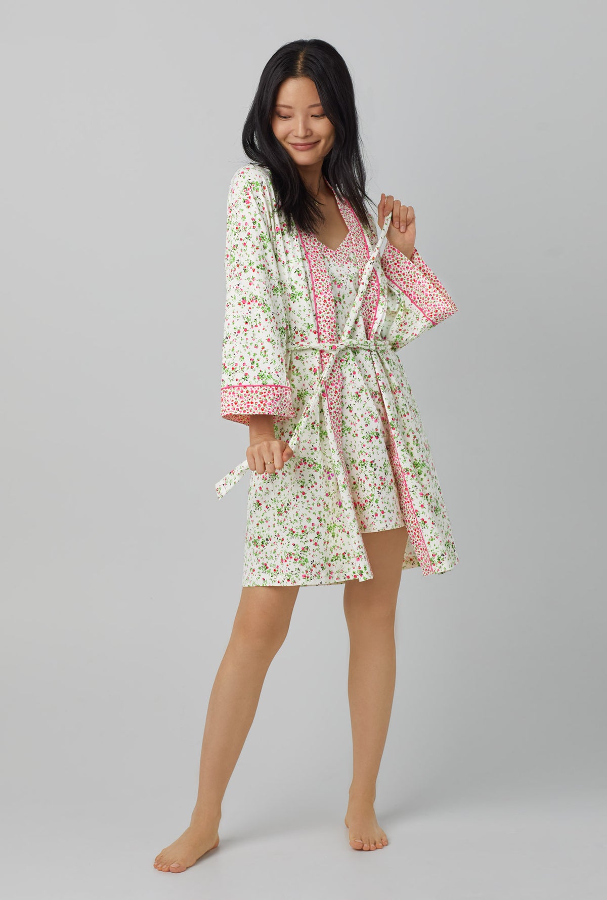 A lady wearing white Collar Stretch Jersey Robe with Nellie print