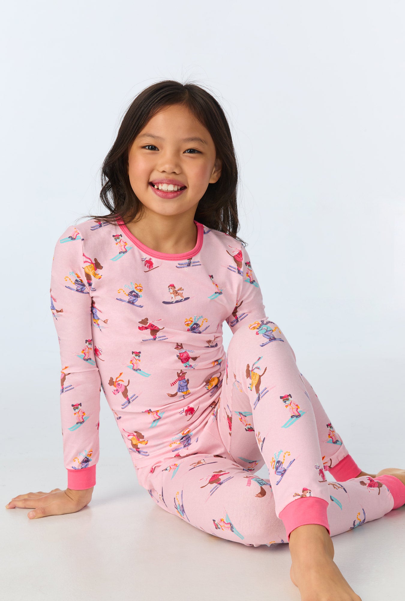 A child wearing Ski Season Long Sleeve Stretch Jersey Kids PJ Set